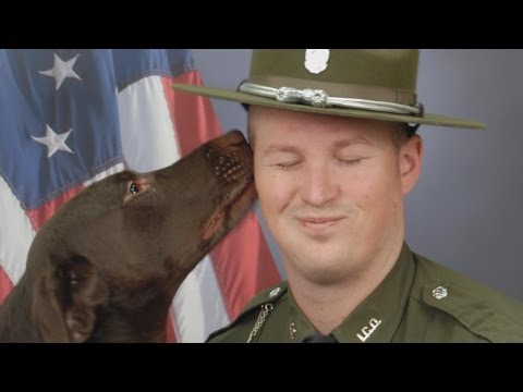 K9 Officer Licks Partner In Their Official Department Photo